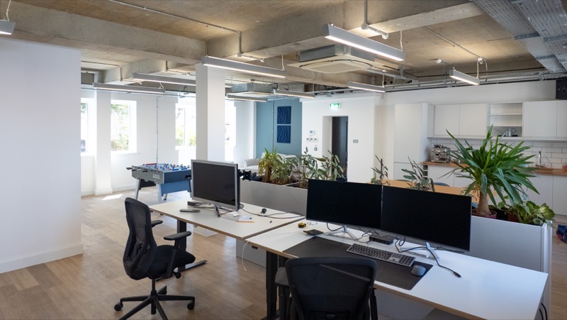 Open plan Grade A+ office space with exposed concrete soffit and planting