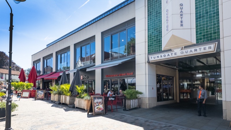 The Tunsgate Quarter entrance with restaurant terraces on the pedestrianised street
